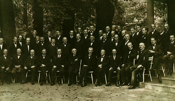 Sepia photograph of O.K. Wille with an orchestra